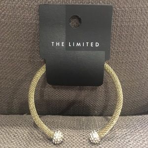 Gold cuff bracelet with gem stone details